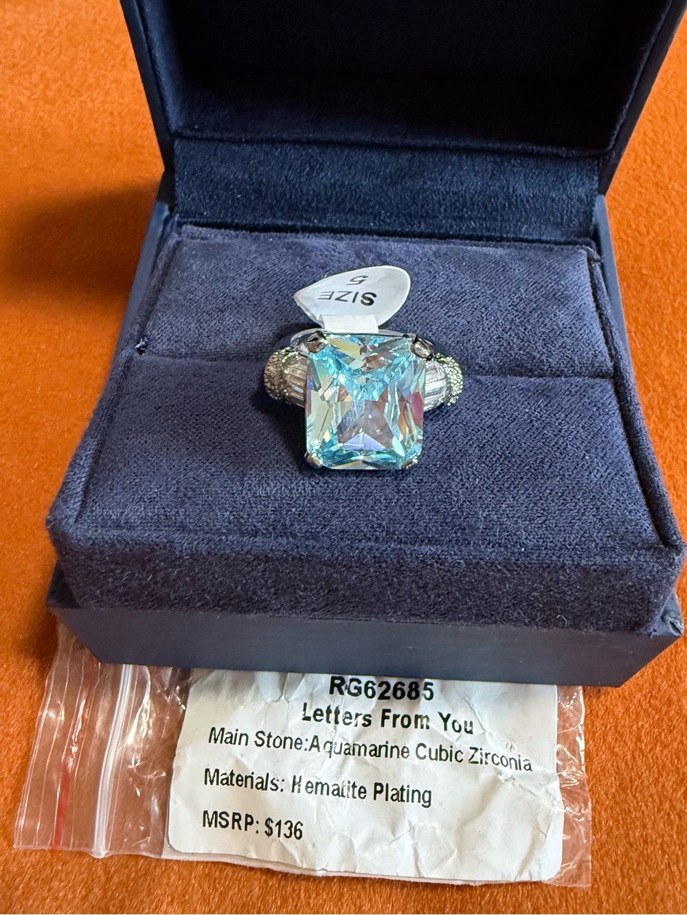 Bomb Party “Letters From You” RG62685 Aquamarine Cubic Zirconia Hematite Size 5
